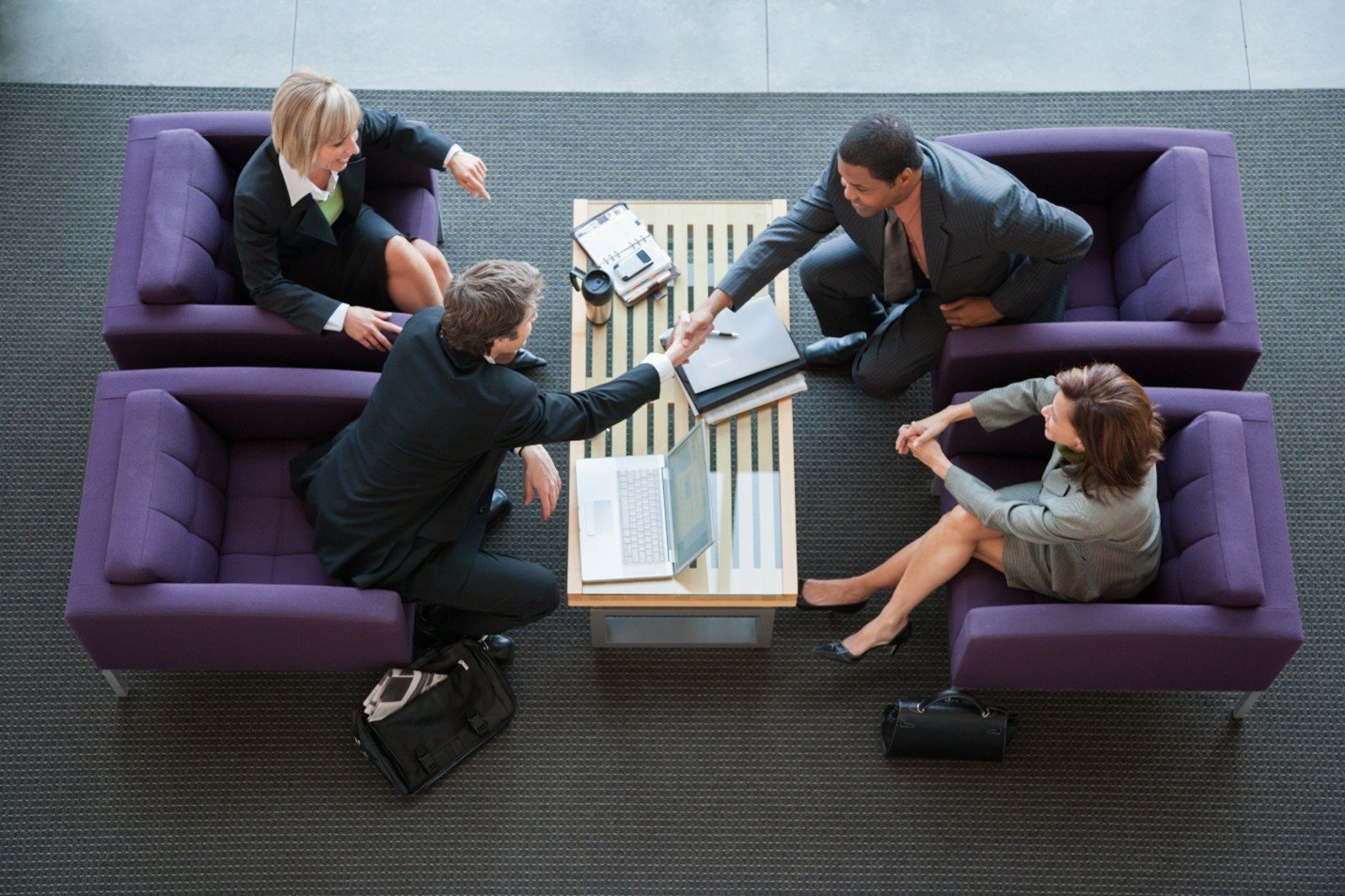 Business owners preparing to sell their business with expert guidance from a business broker to maximize value.